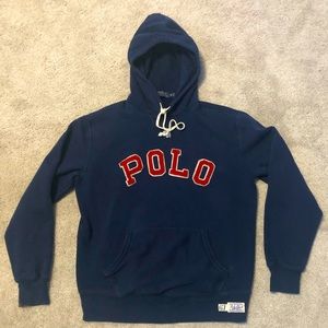 Navy Blue polo by Ralph Lauren, M, w/ red POLO on front.